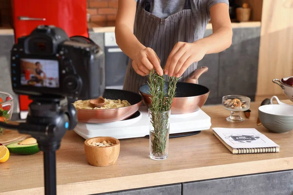 Young Woman Taking Rosemary While Recording Video Class Kitchen Closeup — Stock fotografie