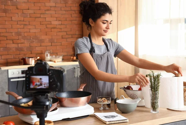 Young Woman Taking Paper Towel While Recording Video Class Kitchen — Stok fotoğraf