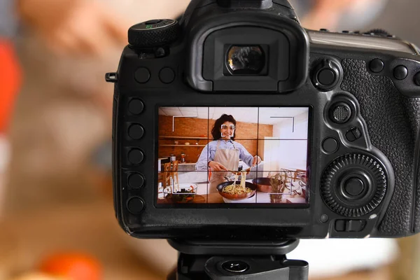 Young Woman Cooking Pasta Display Photo Camera Kitchen Closeup — Stock fotografie