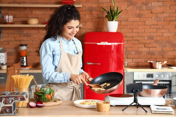 Young Woman Putting Pasta Plate While Recording Video Class Kitchen — Stock fotografie