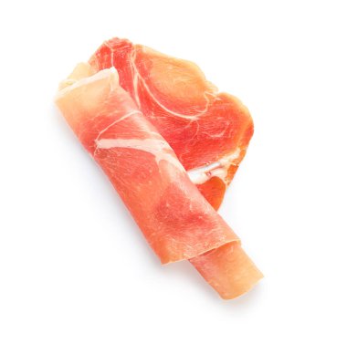 Rolled slice of jamon on white background