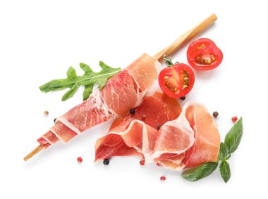 Composition with delicious jamon on white background