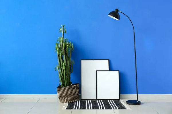 Big Cactus Blank Frames Lamp Blue Wall — Zdjęcie stockowe