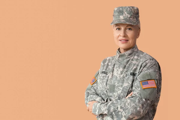 Mature Female Soldier Beige Background — Stockfoto