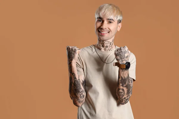 Happy Young Tattooed Man Beige Shirt Brown Background — Stockfoto
