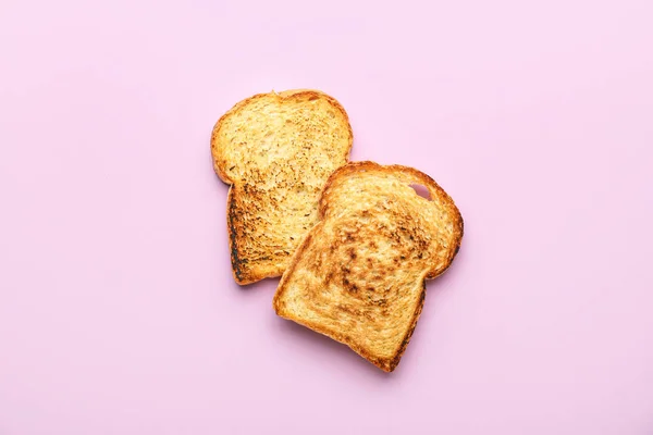Slices Tasty Toasted Bread Pink Background — Fotografia de Stock