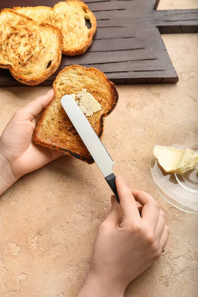 Woman Spreading Butter Toast Color Background Closeup — Zdjęcie stockowe