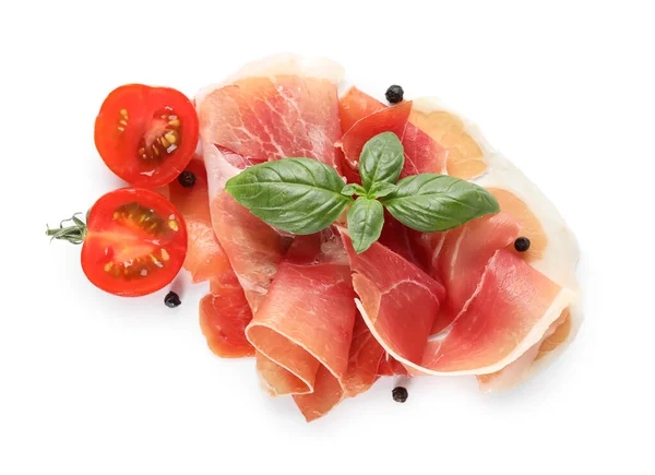 Delicious sliced jamon, spices and tomato on white background