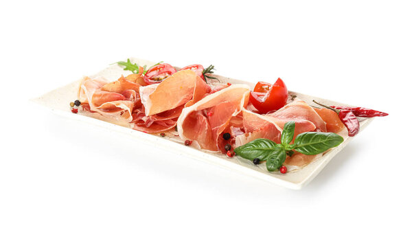 Plate with tasty jamon on white background