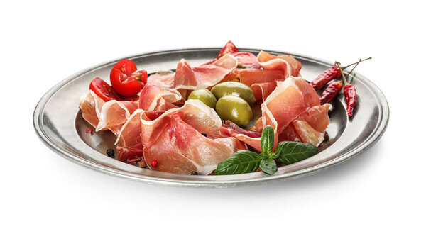 Plate of delicious jamon on white background