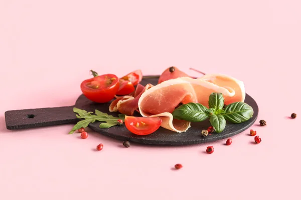 Slate Board Delicious Jamon Spices Tomatoes Pink Background — Stockfoto