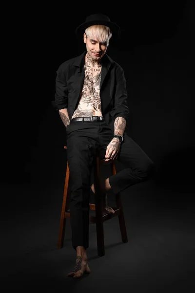 Young Tattooed Man Sitting Stool Black Background Stock Photo