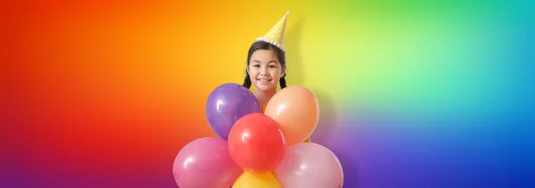 Cute Little Asian Girl Balloons Celebrating Birthday Rainbow Background — Zdjęcie stockowe