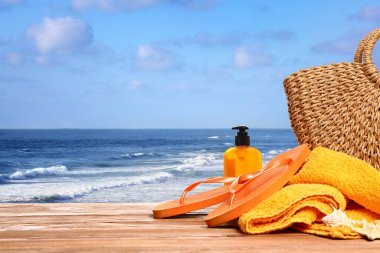 Set of beach accessories on table at sea resort