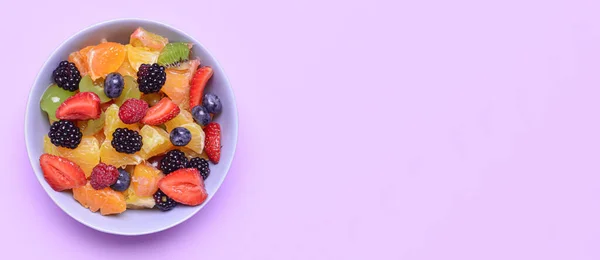 Plate Tasty Fruit Salad Lilac Background Space Text — Stok Foto