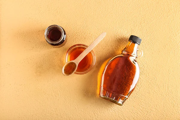 Bottles Bowl Maple Syrup Color Background — стоковое фото