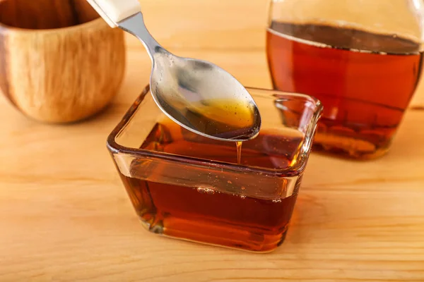 Pouring Maple Syrup Spoon Bowl Wooden Table Closeup —  Fotos de Stock