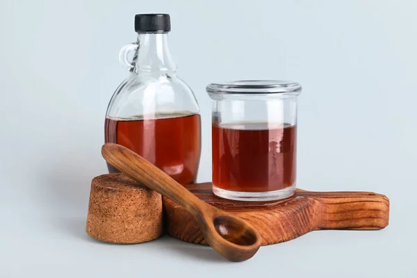 Wooden Board Bottle Jar Tasty Maple Syrup Light Background — стоковое фото