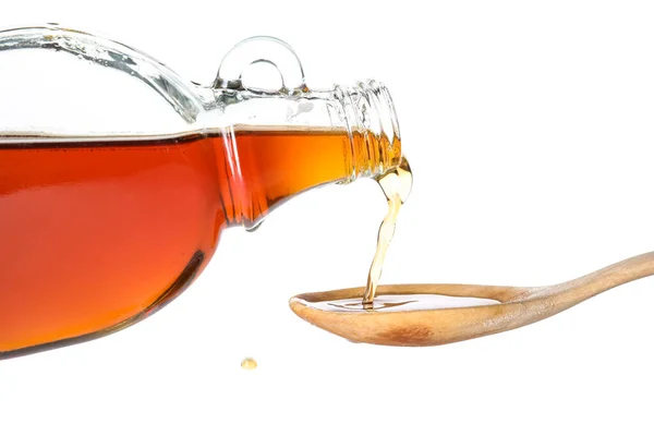 Pouring Tasty Maple Syrup Bottle Spoon White Background Closeup — Foto Stock