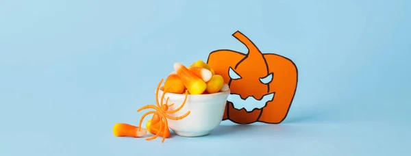 Bowl Tasty Candy Corns Paper Pumpkin Halloween Blue Background — 스톡 사진