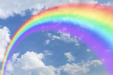 Beautiful rainbow in cloudy sky