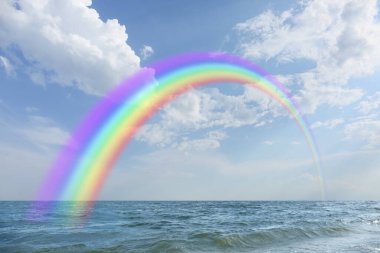 View of sea and beautiful rainbow in sky  