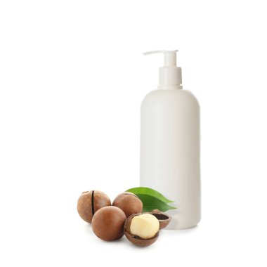 Bottle of natural cosmetics with macadamia extract on white background