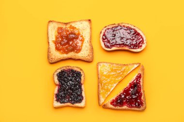 Composition with delicious toasts on color background