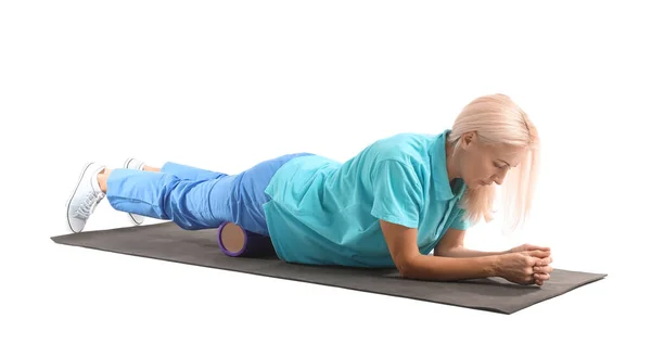 Mature Physiotherapist Training Foam Roller White Background — Stockfoto