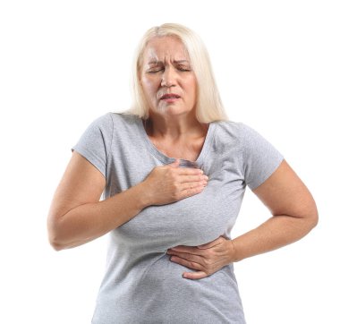 Mature woman suffering from breast pain on white background