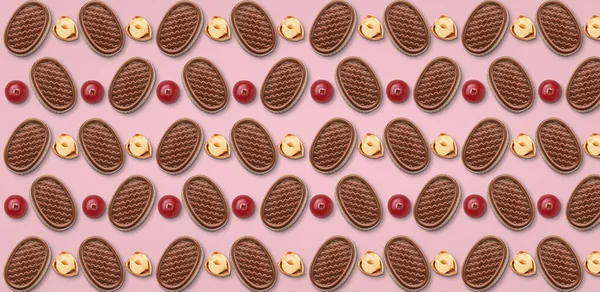 Many Tasty Chocolate Candies Nuts Berries Pink Background Pattern Design — Stockfoto