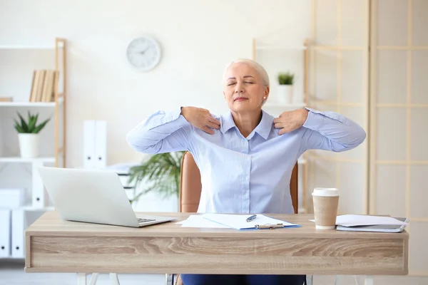 Mature Businesswoman Back Pain Doing Exercise Office — Stok fotoğraf