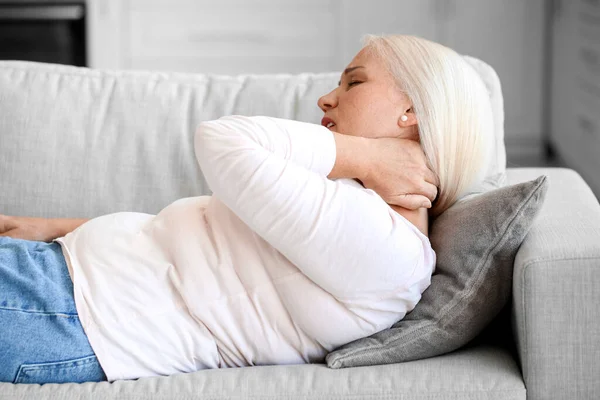 Mature Woman Suffering Neck Pain Sofa Home — ストック写真