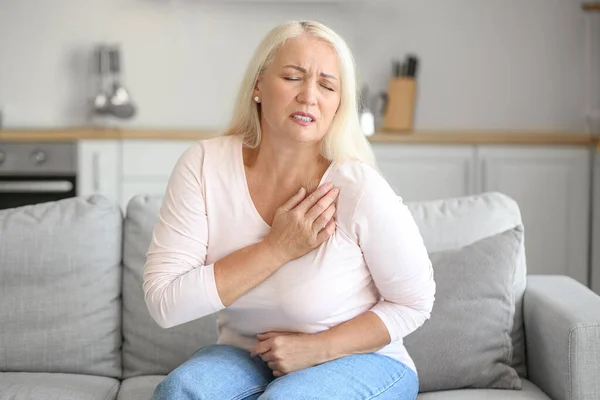 Mature Woman Suffering Breast Pain Kitchen — Stock Fotó