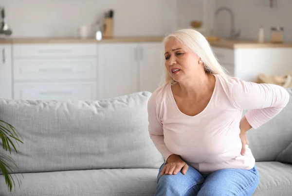 Mature Woman Suffering Back Pain Kitchen — Stock Fotó