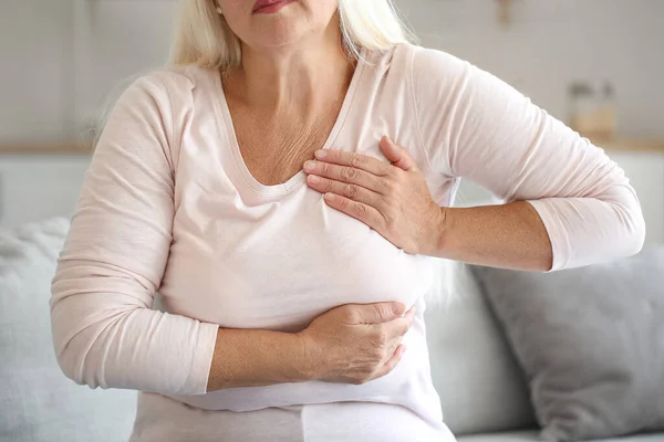 Mature Woman Suffering Breast Pain Kitchen — Stockfoto