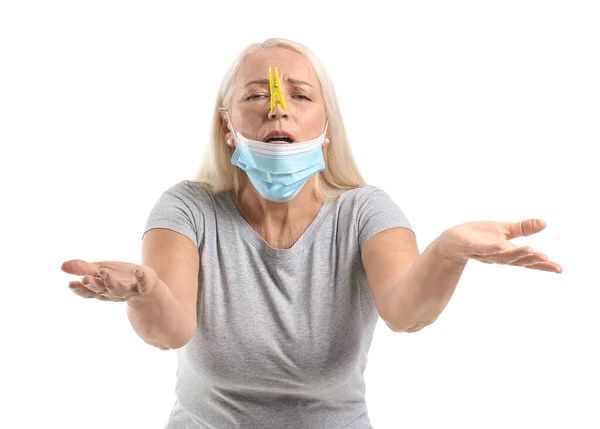 Stressed Mature Woman Clothespin Medical Mask White Background Stuffy Nose — Fotografia de Stock