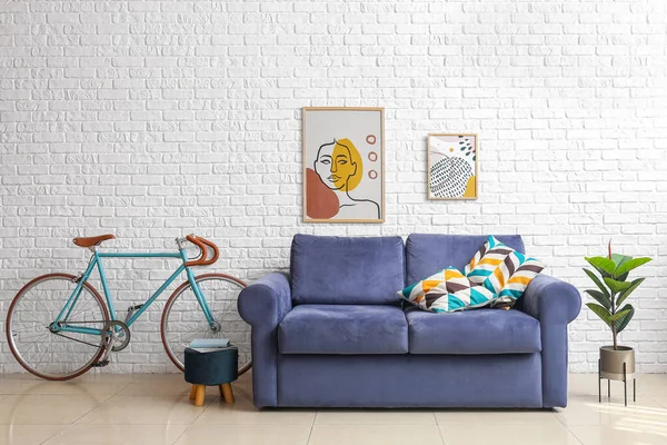 Bicycle Blue Sofa Pouf Houseplant White Brick Wall — Stok fotoğraf