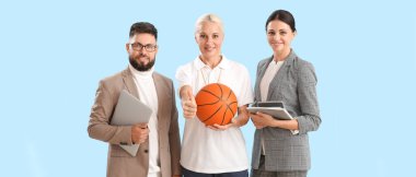 Portrait of teachers on light blue background