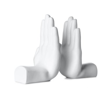 Bookend in shape of hands on white background