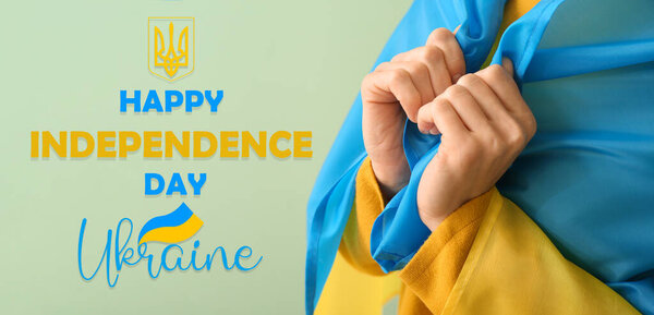 Young woman with flag of Ukraine on color background, closeup. Banner for Ukrainian Independence Day
