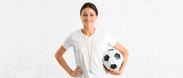 Female Physical Education Teacher Ball White Brick Background — Stockfoto