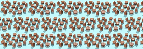 Many tasty peanut butter cups on blue background