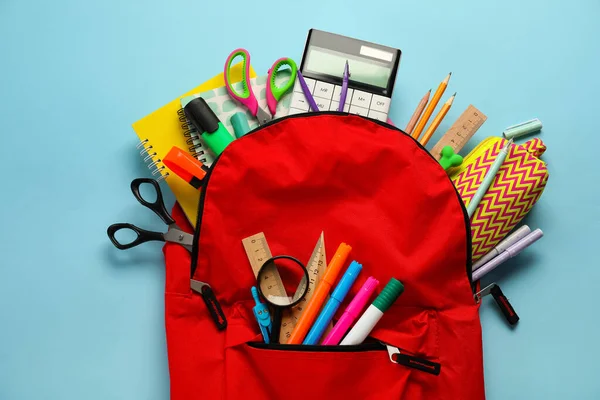 Red Backpack School Stationery Blue Background — Zdjęcie stockowe