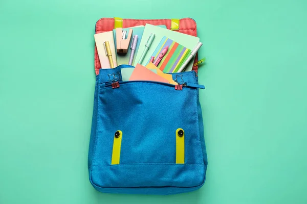 Blue Backpack School Stationery Green Background — Fotografia de Stock