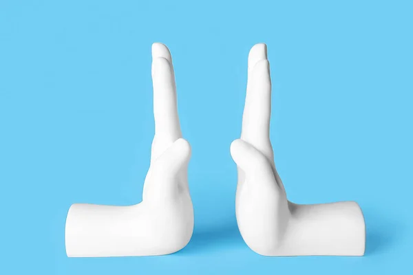 Bookend Shape Hands Blue Background — 스톡 사진