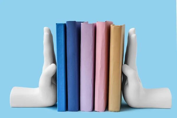 Books Stands Shape Hands Blue Background — Zdjęcie stockowe