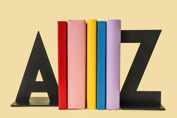 Books Stands Shape Letters Beige Background — Foto de Stock