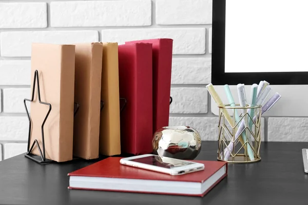 Holder Books Pen Cup Mobile Phone Table White Brick Wall — Stockfoto