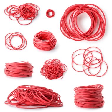 Collection of red elastic bands on white background